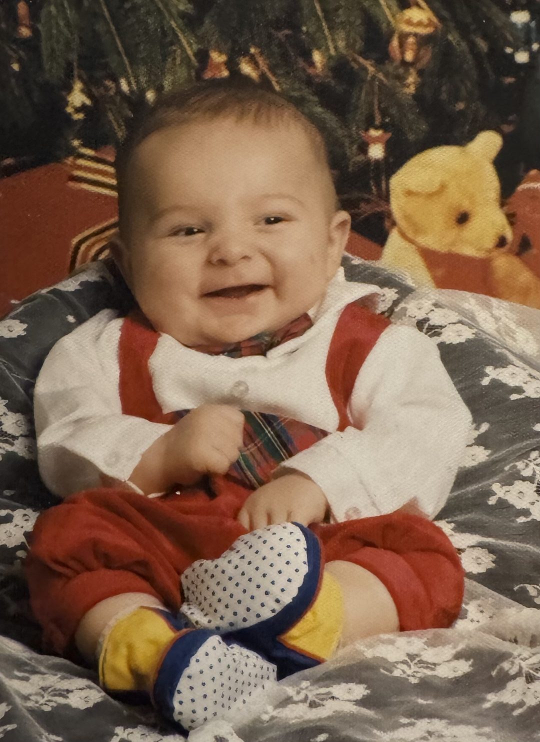 Baby John in front of a Christmas tree, 1994.