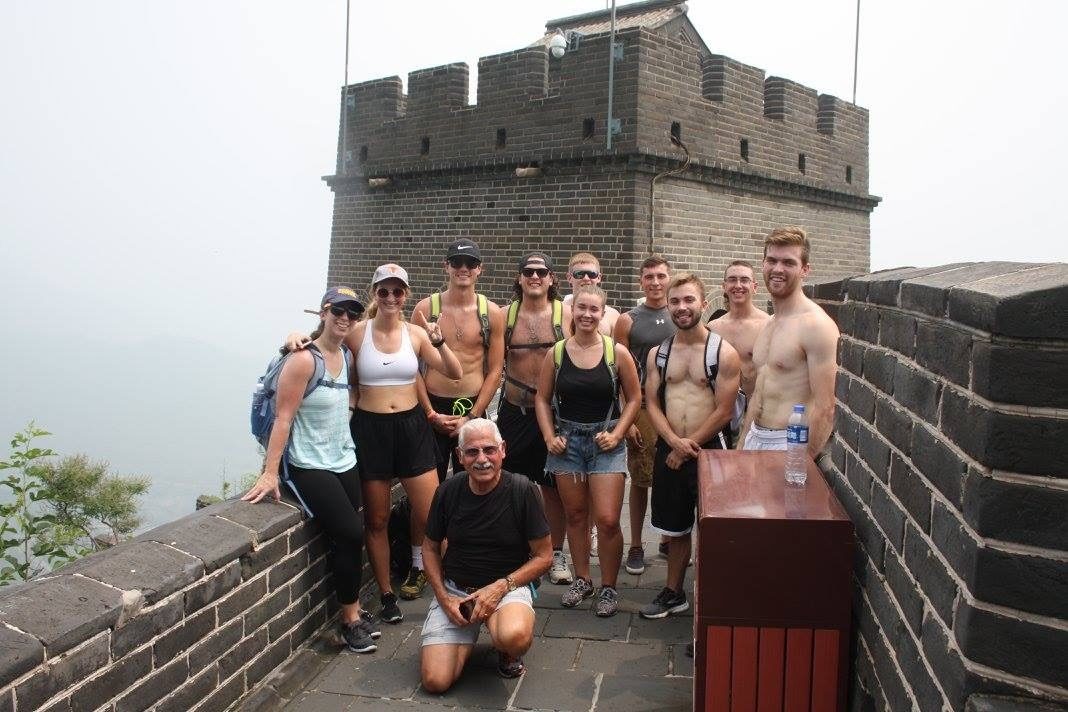 John's travel group posed atop a watchtower on the Great Wall of China in 2017.